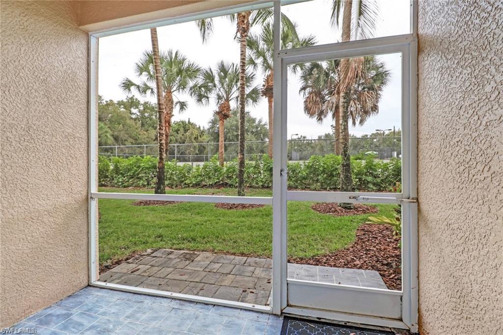 9801 Foxhall Way, Unit 4 Estero, FL 33928 - Photo 15 of 23 Doorway with a textured wall