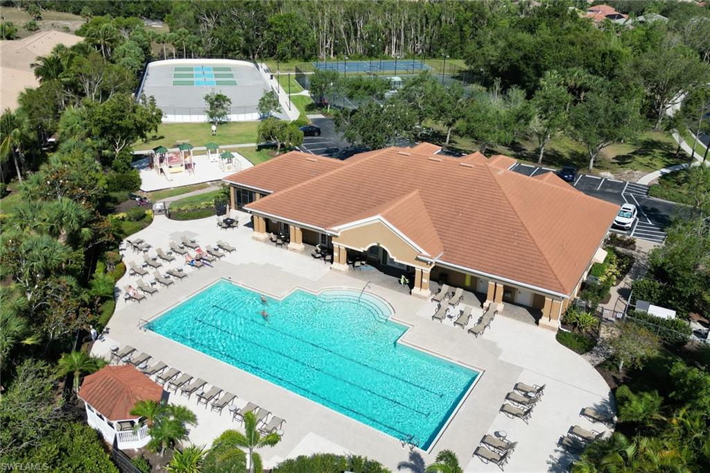 9801 Foxhall Way, Unit 4 Estero, FL 33928 - Photo 16 of 23 Community pool with a patio area