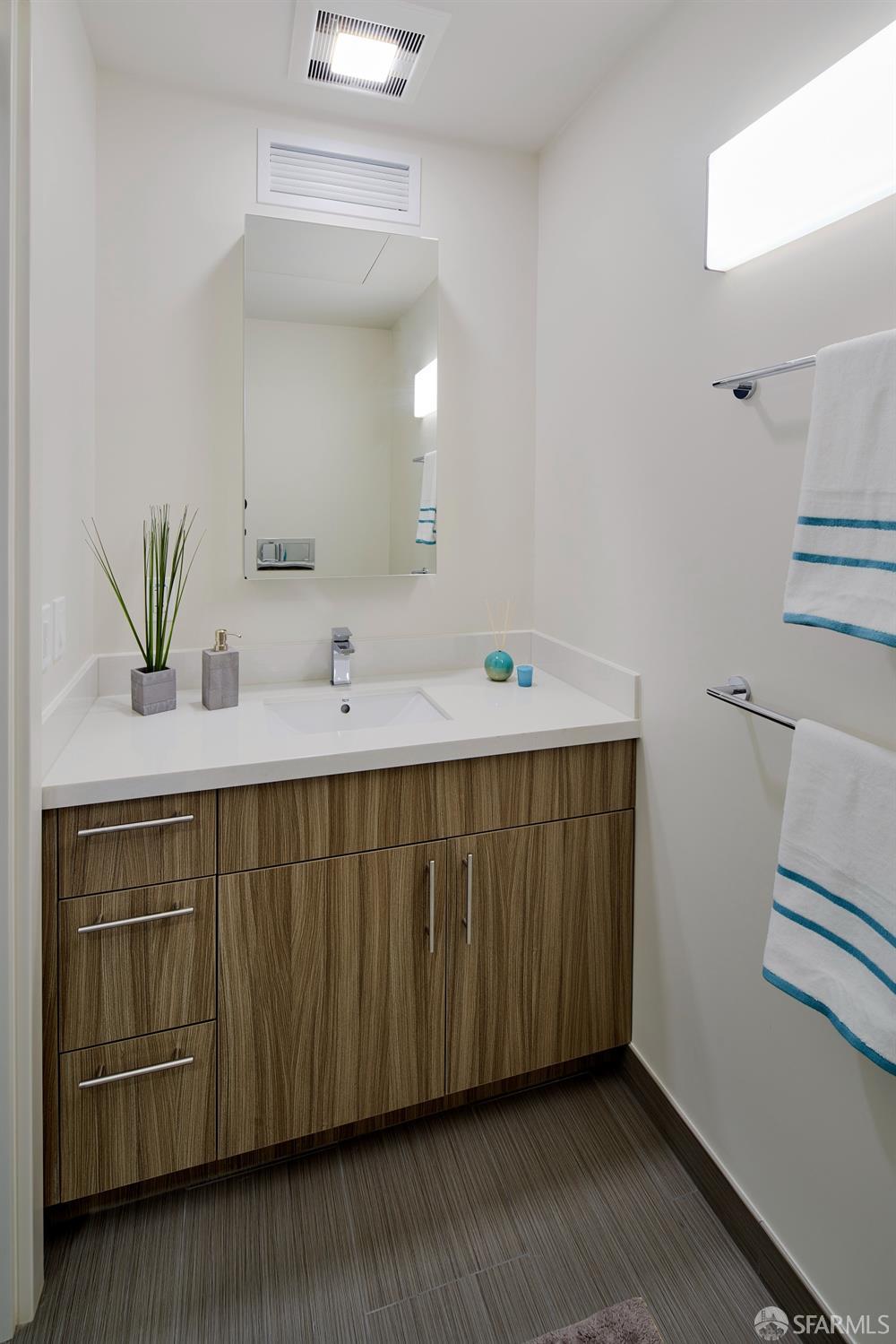 2711 Shattuck Avenue Berkeley, CA 94705 - Photo 24 of 26 a bathroom with a sink and a mirror