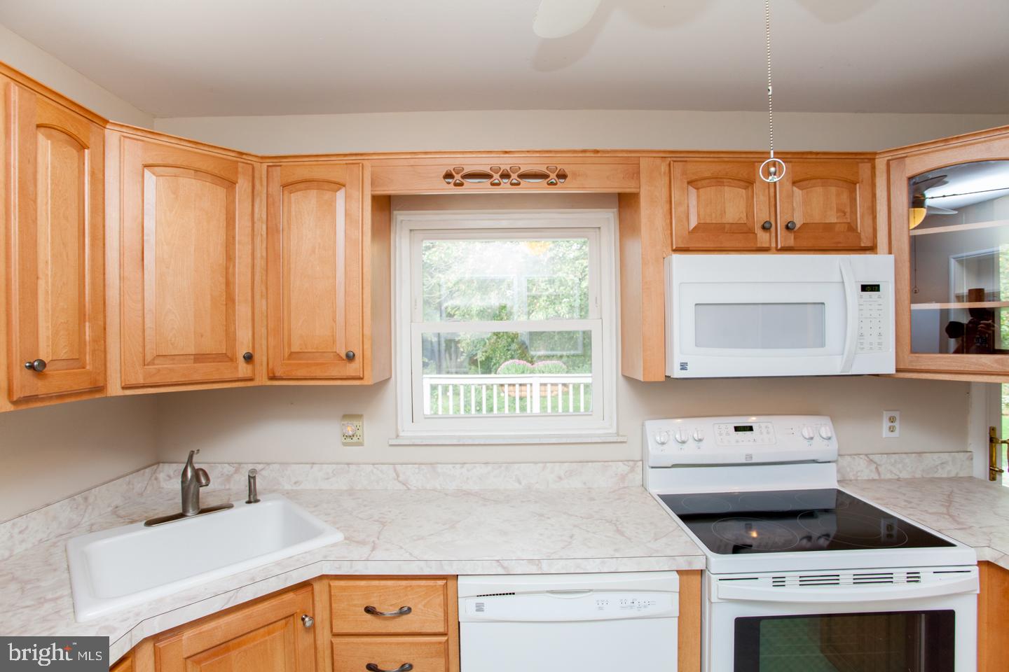 518 Upper Stump Road Chalfont, PA 18914 - Photo 22 of 62 a kitchen with granite countertop a sink a stove and cabinets