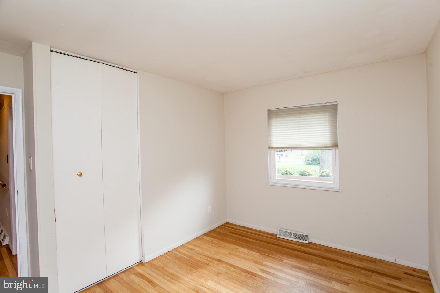 518 Upper Stump Road Chalfont, PA 18914 - Photo 35 of 62 a view of an empty room with wooden floor and a window