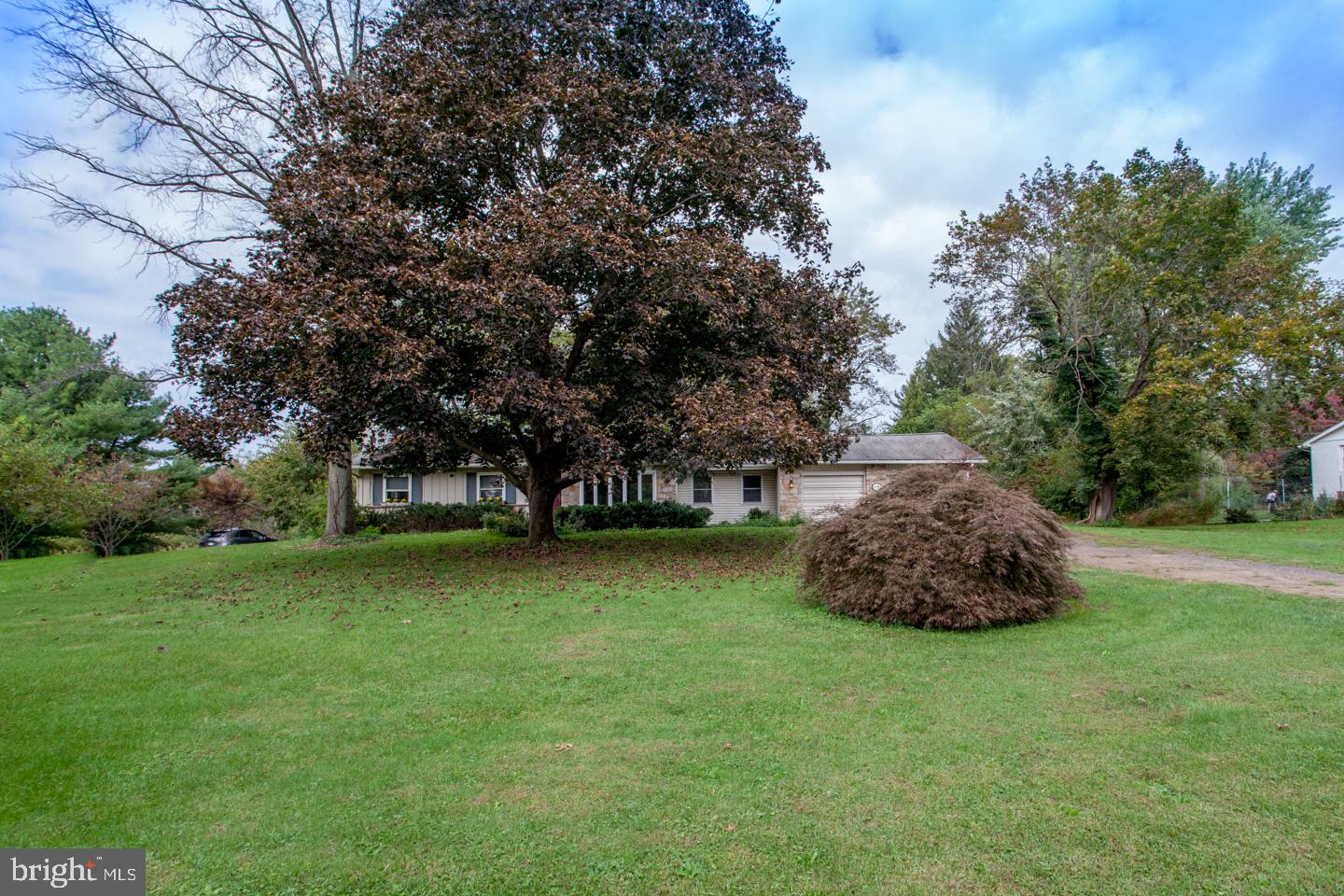 518 Upper Stump Road Chalfont, PA 18914 - Photo 6 of 62 a big yard with lots of green space and trampoline