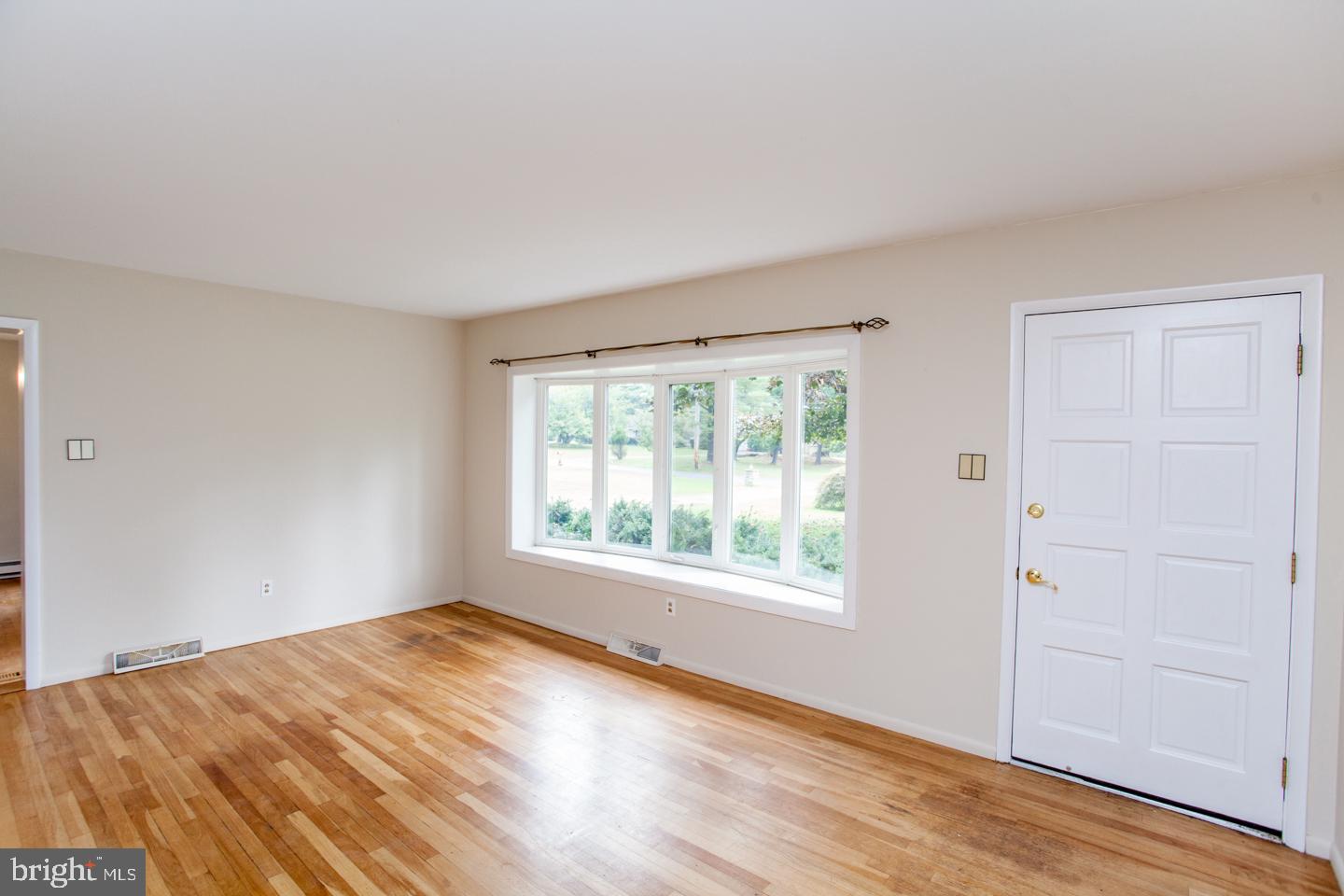 518 Upper Stump Road Chalfont, PA 18914 - Photo 10 of 62 an empty room with wooden floor and windows
