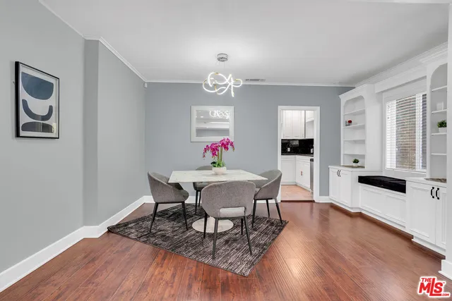 a dining room with furniture window wooden floor
