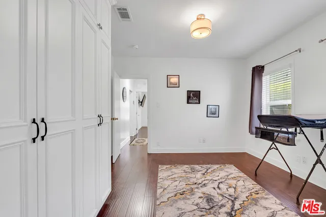 a bedroom with a bed and a table in it