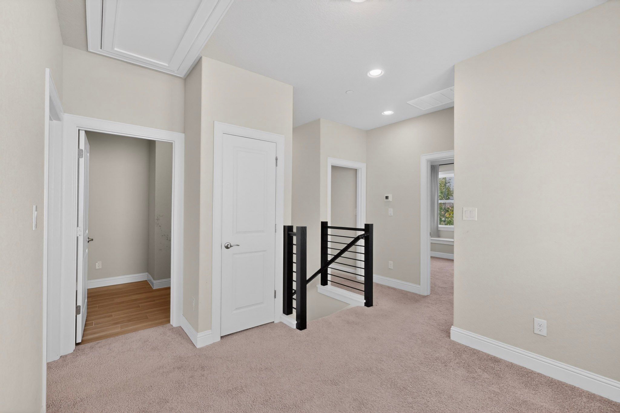 2605 Sam Bass Road, Unit 9 Round Rock, TX 78681 - Photo 21 of 38 A versatile upper landing with plush carpeting and natural light, ready for personalization.