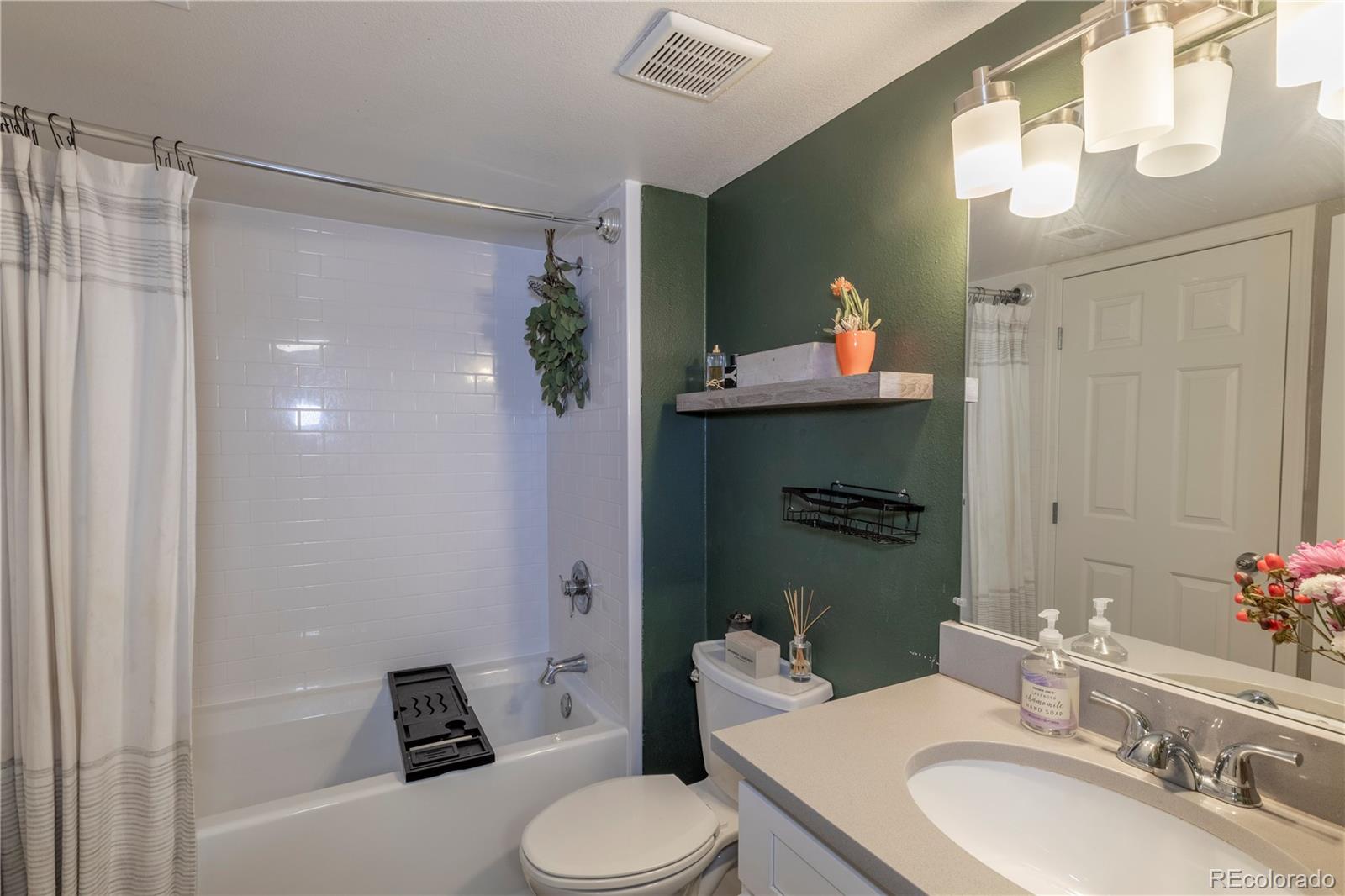 2575 South Syracuse Way, Unit M206 Denver, CO 80231 - Photo 16 of 24 a bathroom with a sink toilet and shower