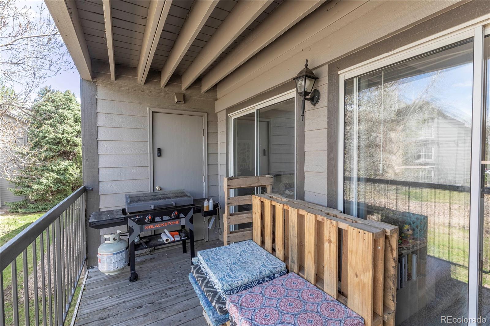 2575 South Syracuse Way, Unit M206 Denver, CO 80231 - Photo 17 of 24 a view of a balcony with chairs