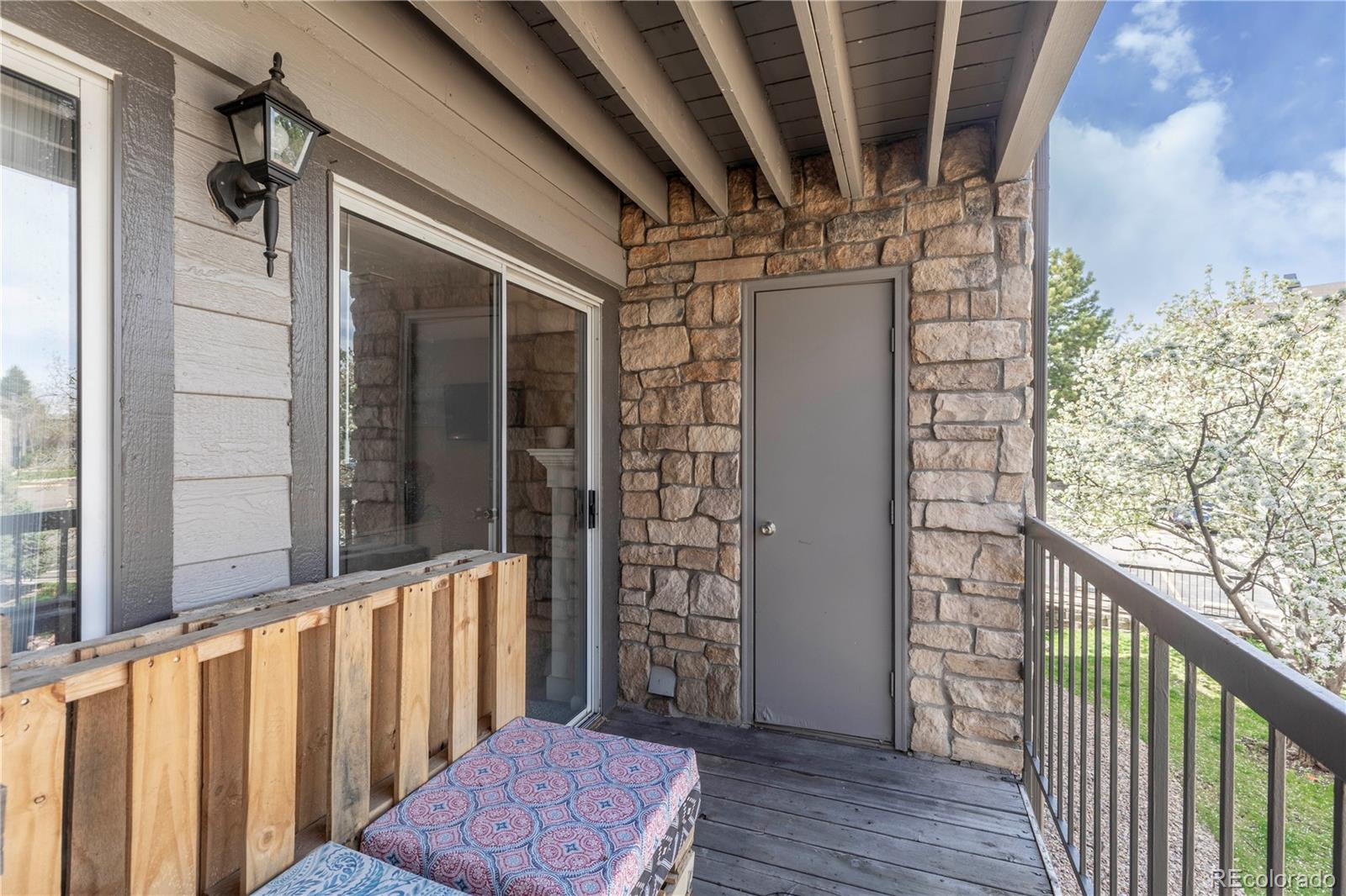 2575 South Syracuse Way, Unit M206 Denver, CO 80231 - Photo 18 of 24 a view of balcony with wooden floor