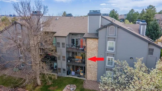 a front view of a building with outdoor seating