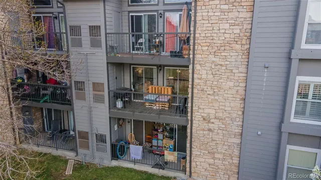an aerial view of multiple houses with a yard