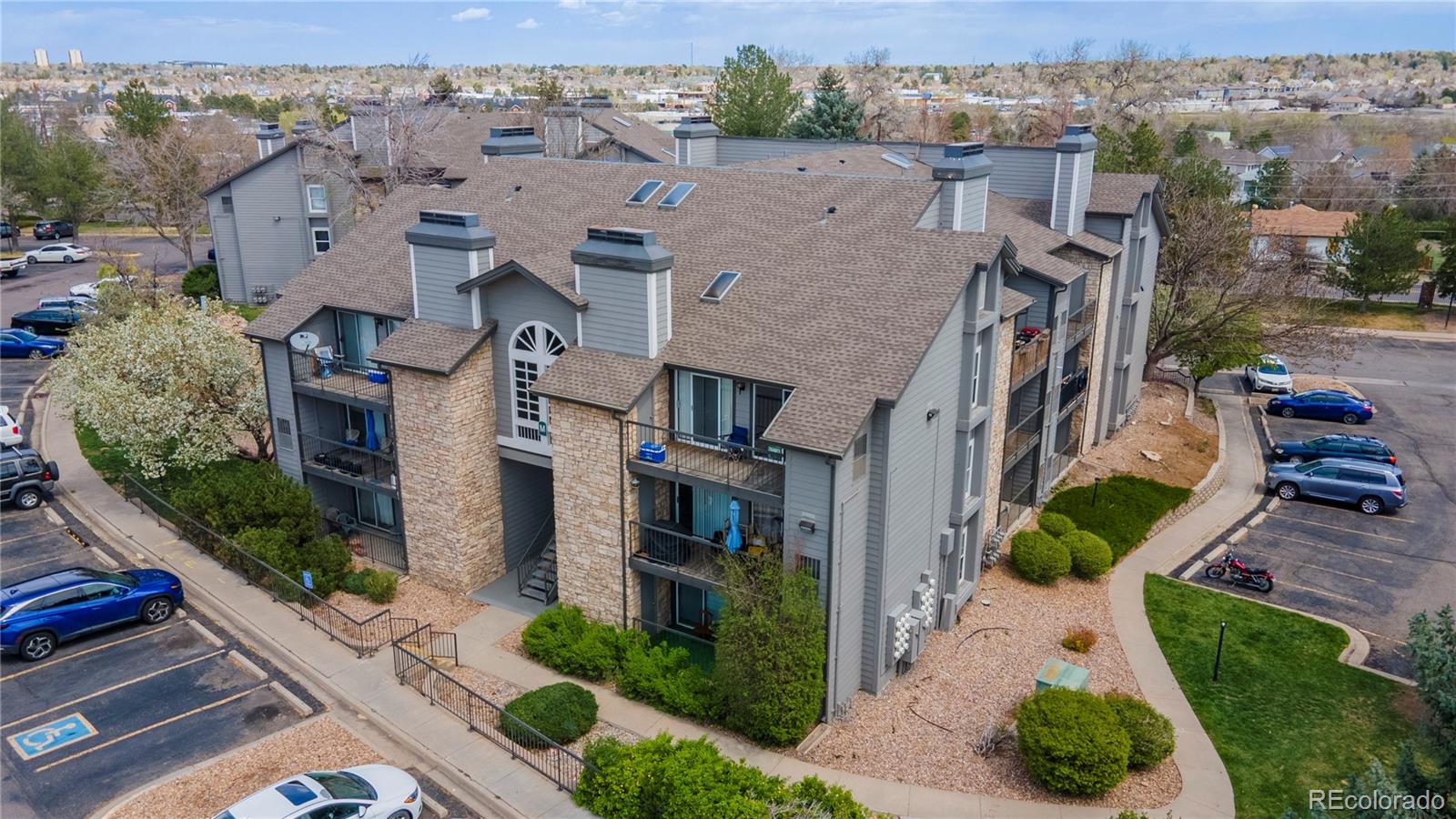 2575 South Syracuse Way, Unit M206 Denver, CO 80231 - Photo 22 of 24 an aerial view of multiple houses with a yard