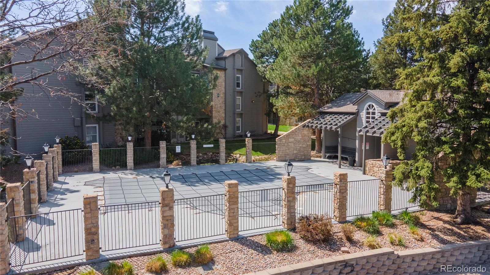 2575 South Syracuse Way, Unit M206 Denver, CO 80231 - Photo 23 of 24 a view of a house with fountain and garden