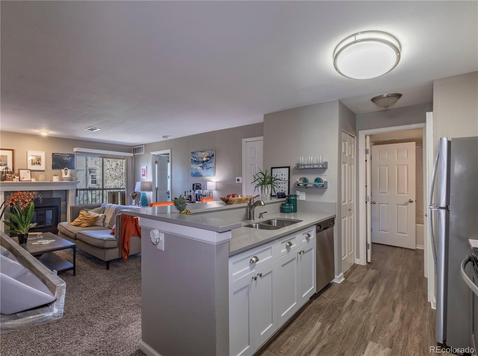2575 South Syracuse Way, Unit M206 Denver, CO 80231 - Photo 3 of 24 a view of kitchen and sink