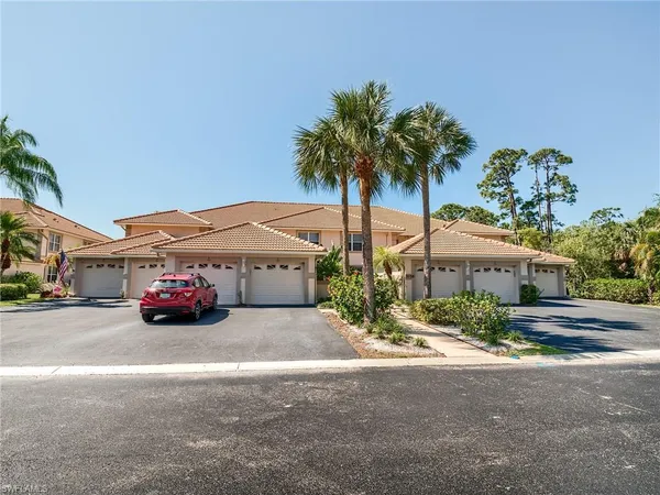 a view of a car is parked in front of a house