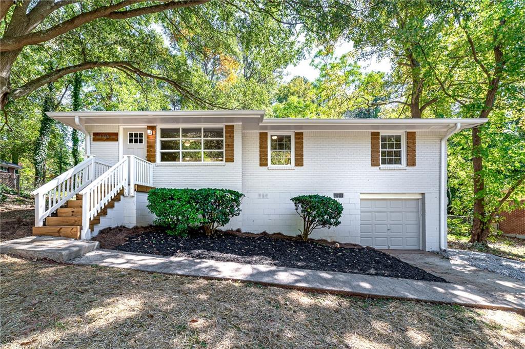 1716 Hollyhock Terrace Decatur, GA 30032 - Photo 1 of 1 front view of a house with a yard