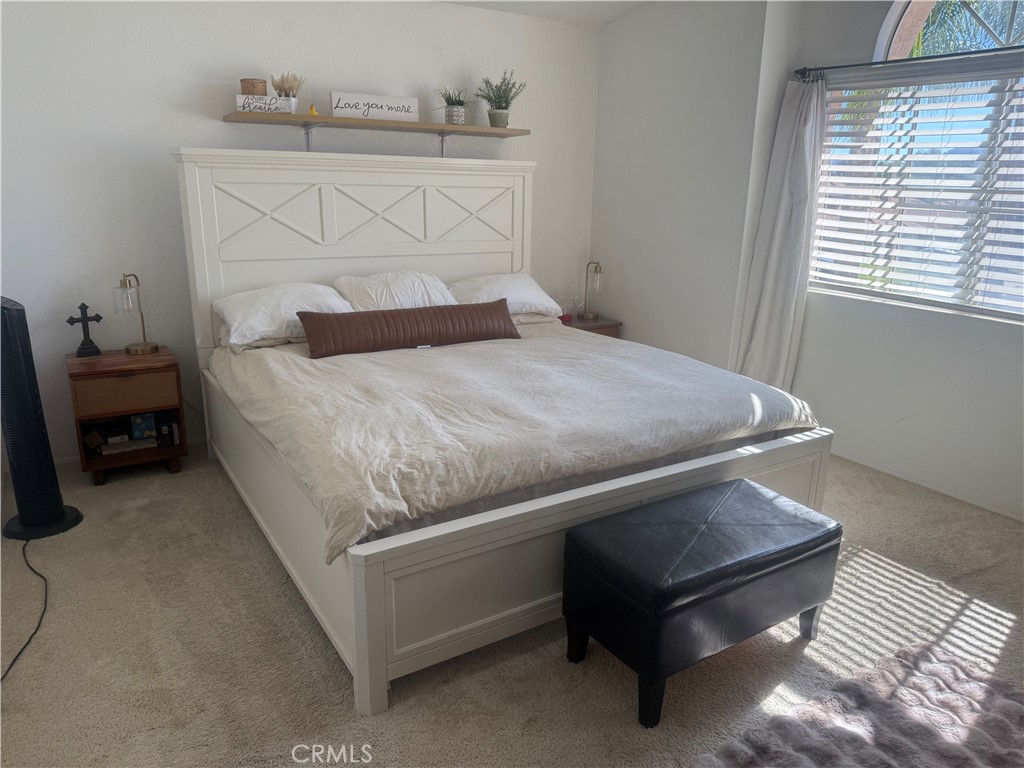29870 Vail Brook Drive Temecula, CA 92591 - Photo 13 of 14 a bed sitting in a bedroom next to a window