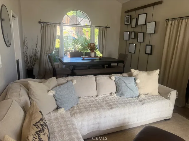 a living room with a large window and a couch