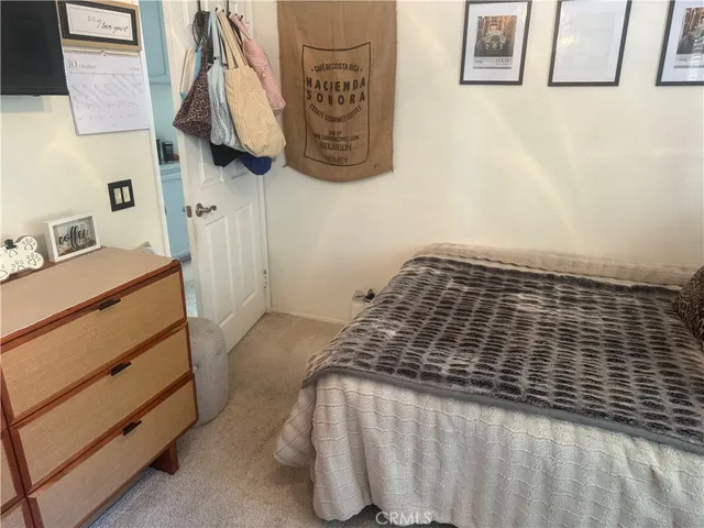 a bedroom with a bed and a cabinets
