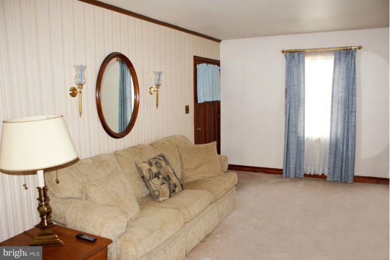 22 Mansion Road Linthicum Heights, MD 21090 - Photo 1 of 20 a living room with furniture a mirror and a window