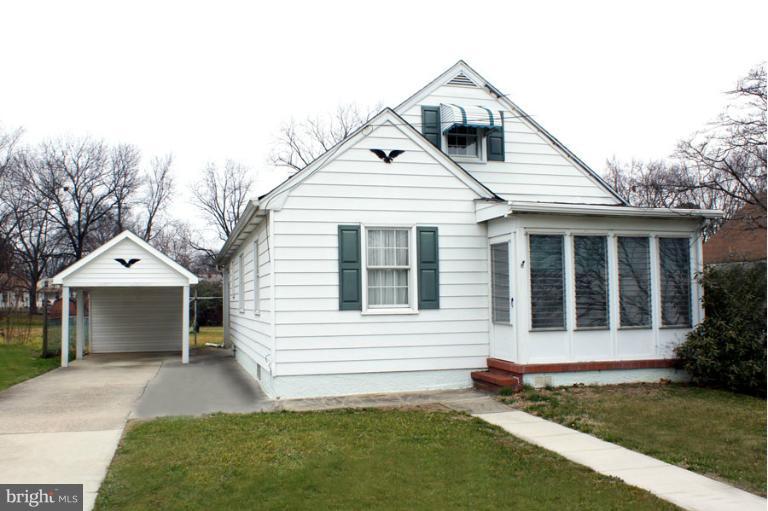 22 Mansion Road Linthicum Heights, MD 21090 - Photo 2 of 20 a front view of a house with a yard and garage