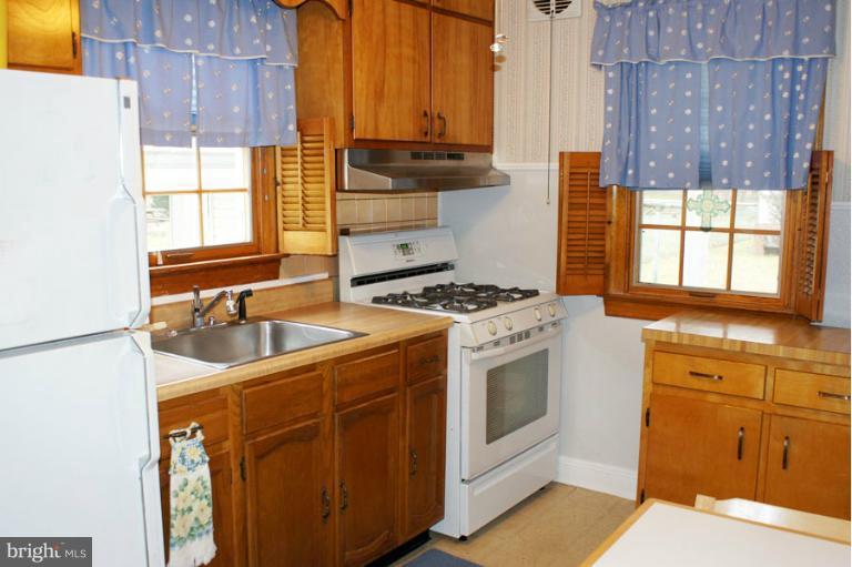 22 Mansion Road Linthicum Heights, MD 21090 - Photo 12 of 20 a kitchen with stainless steel appliances granite countertop a sink stove and cabinets