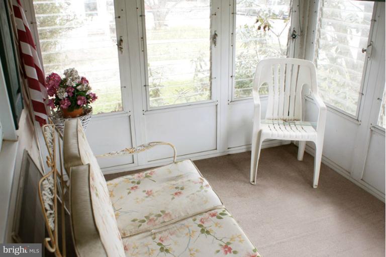 22 Mansion Road Linthicum Heights, MD 21090 - Photo 16 of 20 a view of a room with a large window and chair