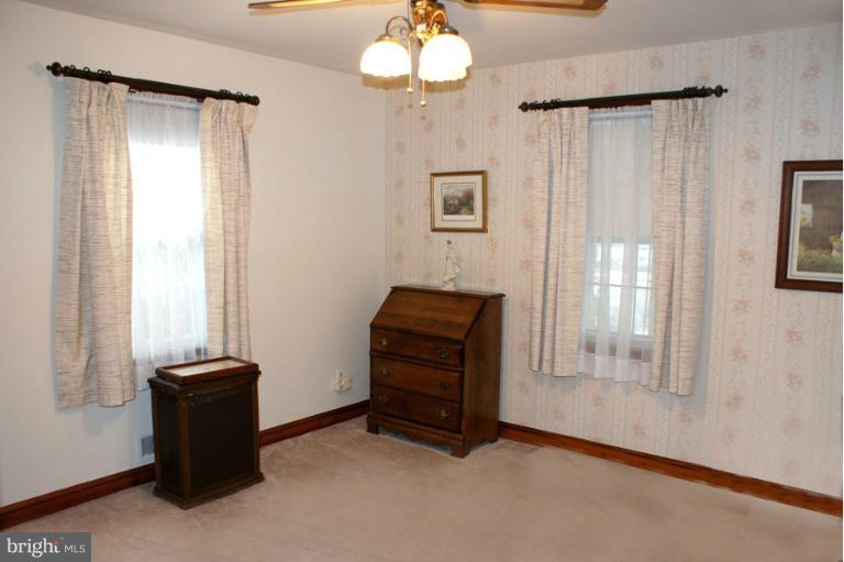 22 Mansion Road Linthicum Heights, MD 21090 - Photo 17 of 20 wooden floor in an empty room with a window