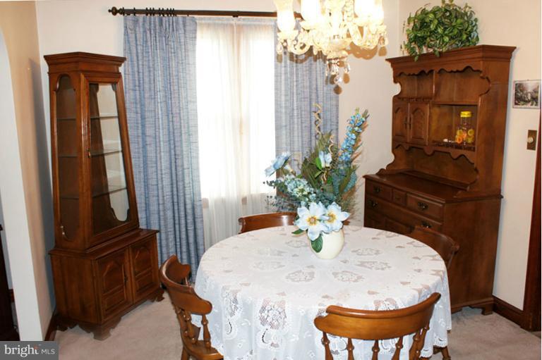 22 Mansion Road Linthicum Heights, MD 21090 - Photo 3 of 20 a dining room with furniture and wooden floor