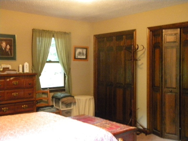 280 George Home Road Waynesboro, VA 22980 - Photo 11 of 29 a bedroom with a bed a dresser and a window