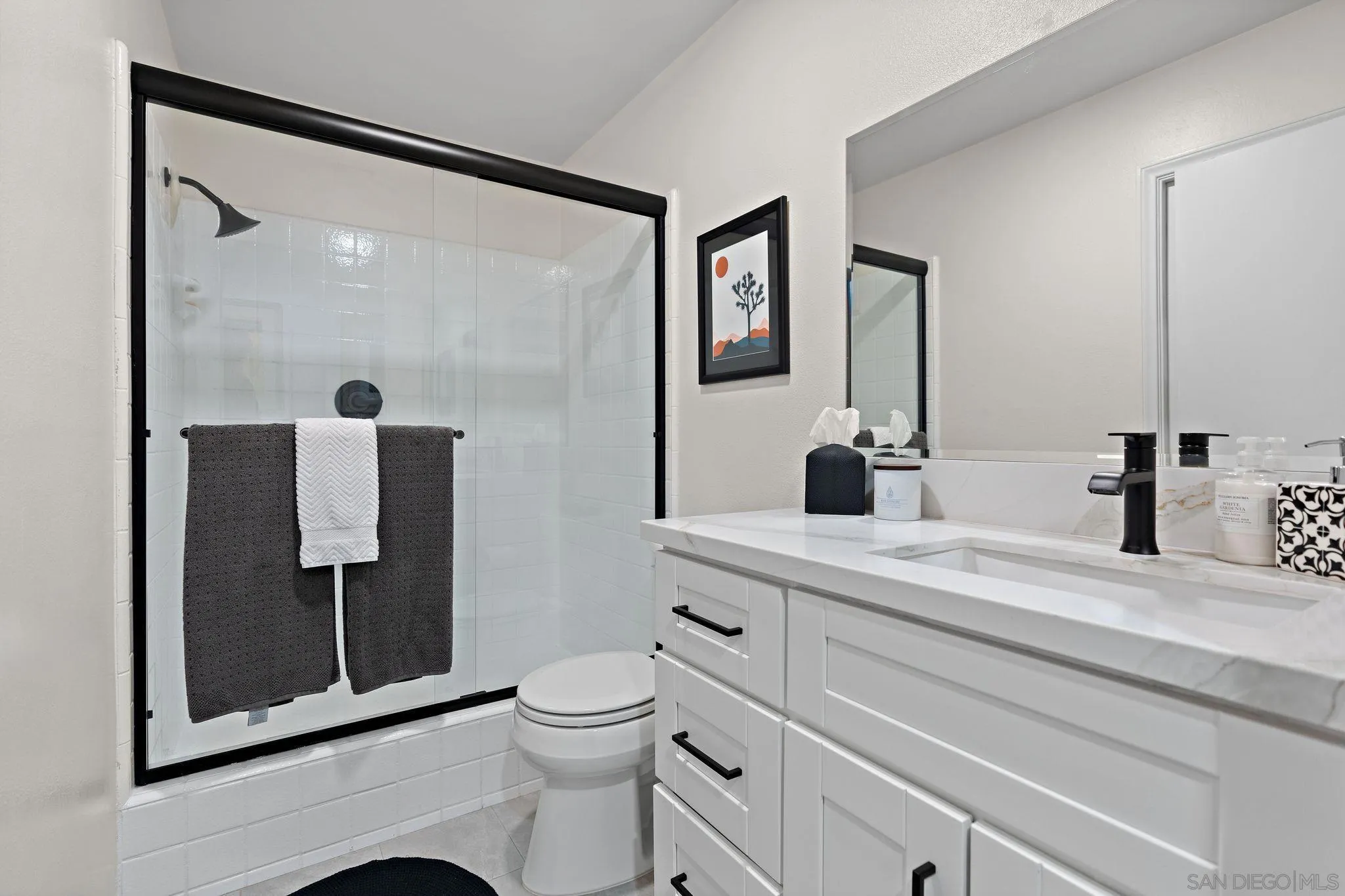 34020 Madera De Playa Drive Temecula, CA 92592 - Photo 15 of 24 a bathroom with a toilet a sink and glass door