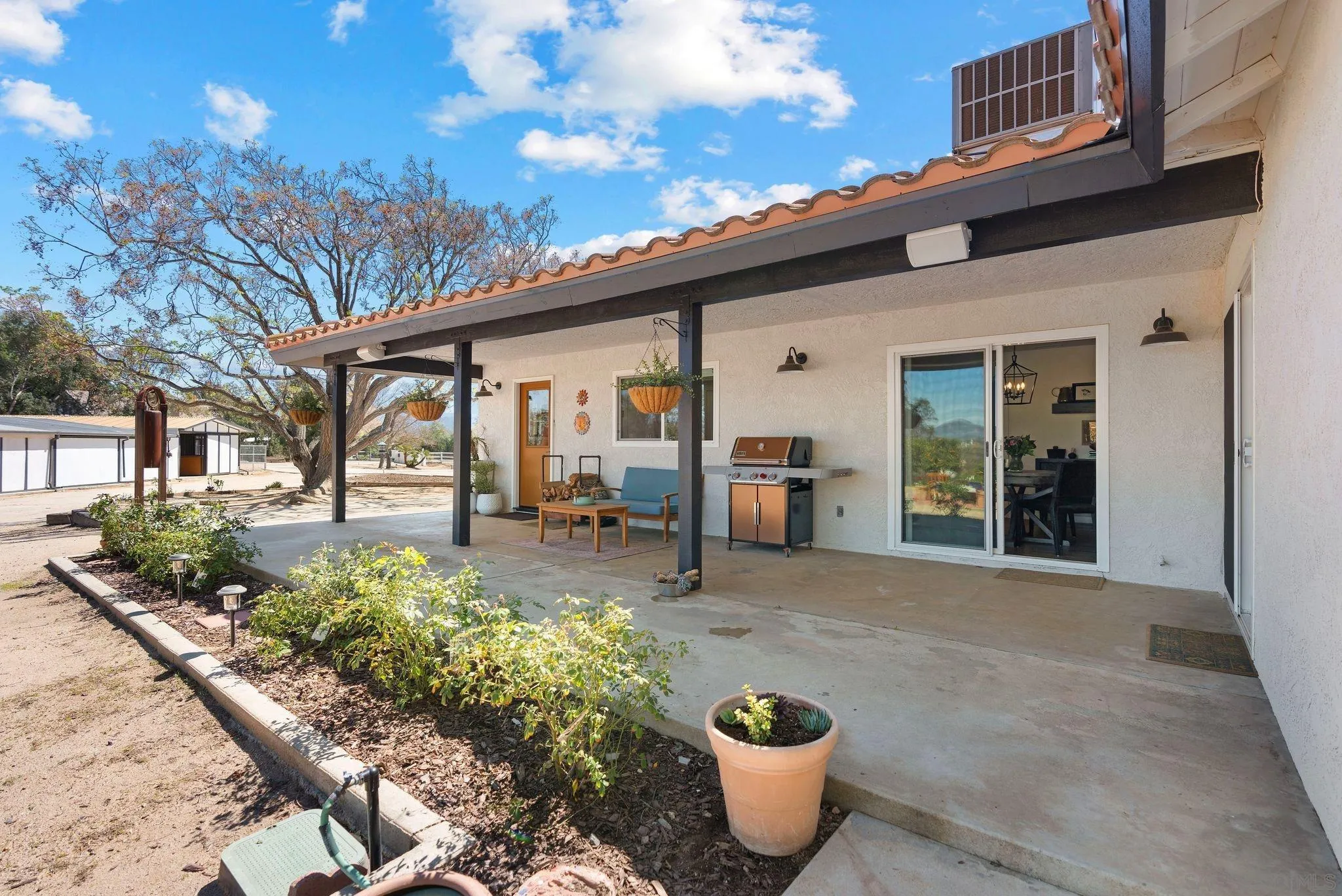 34020 Madera De Playa Drive Temecula, CA 92592 - Photo 21 of 24 a view of a patio with table and chairs and potted plants