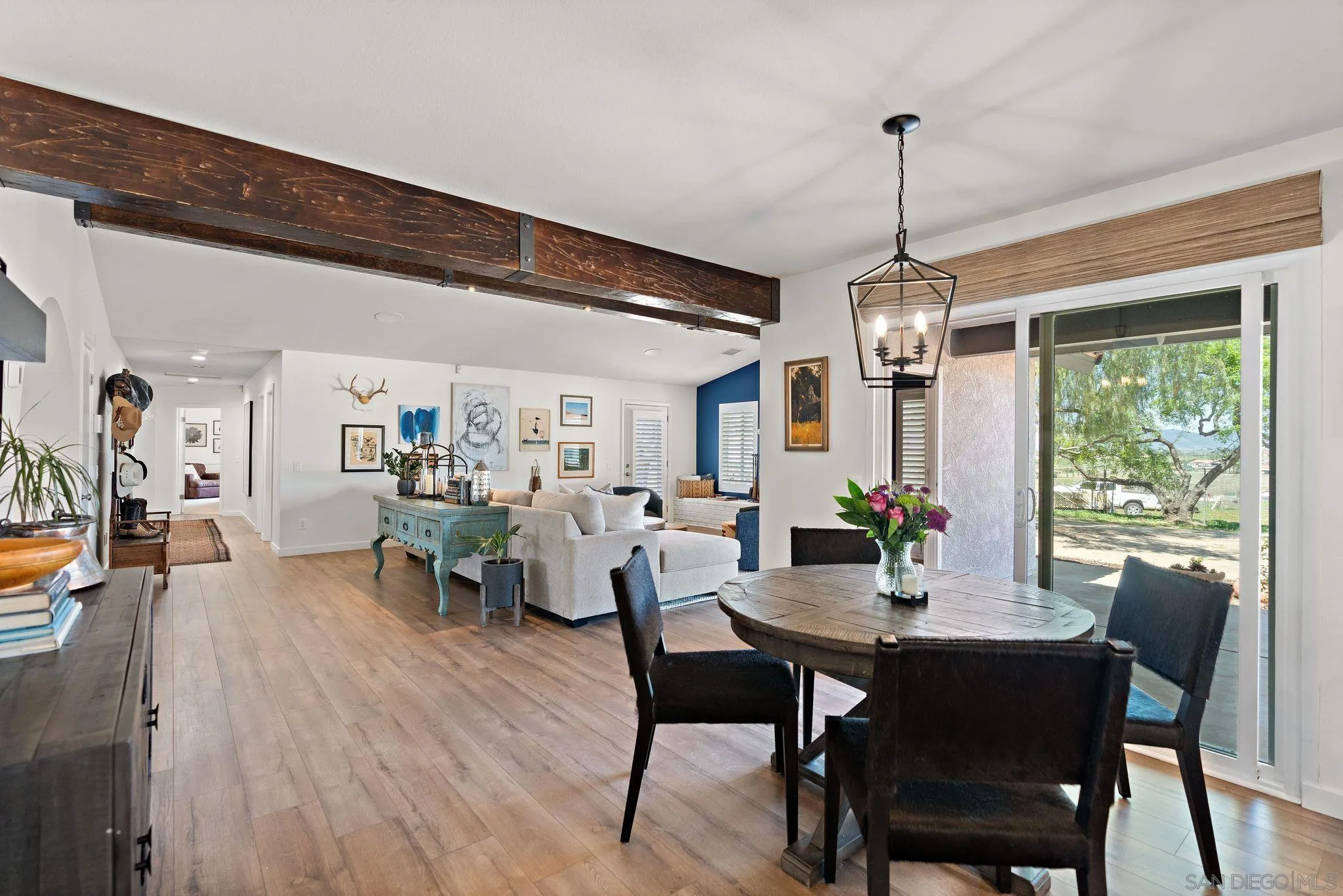 34020 Madera De Playa Drive Temecula, CA 92592 - Photo 7 of 24 a view of a dining room and livingroom with furniture wooden floor a chandelier