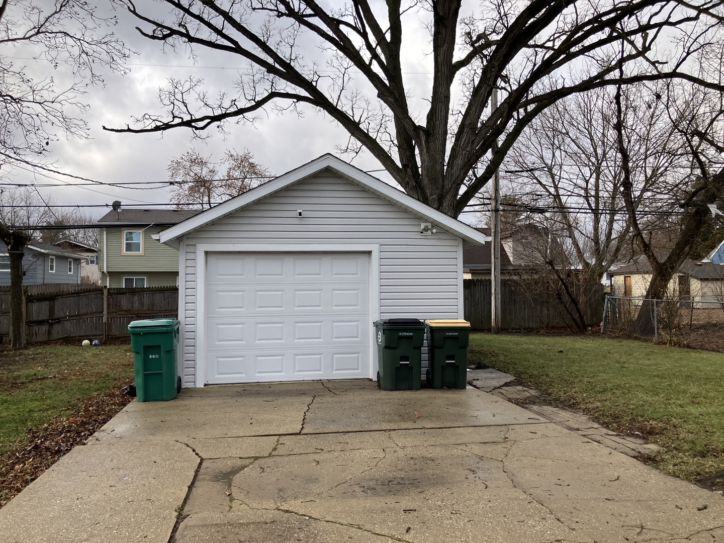 1432 Ridgeway Street Round Lake Beach, IL 60073 - Photo 2 of 20 a front view of a house with a yard and garage