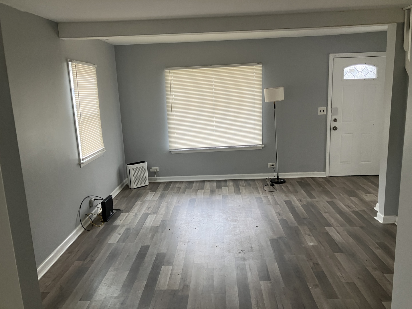 1432 Ridgeway Street Round Lake Beach, IL 60073 - Photo 6 of 20 a view of a room with wooden floor and a window
