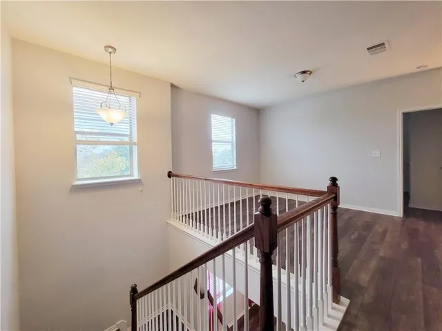 a view of a hallway with windows