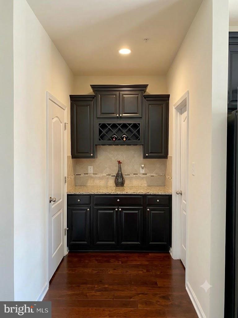 7014 Foxton Way Hanover, MD 21076 - Photo 3 of 29 Elegant nook with dark cabinetry.