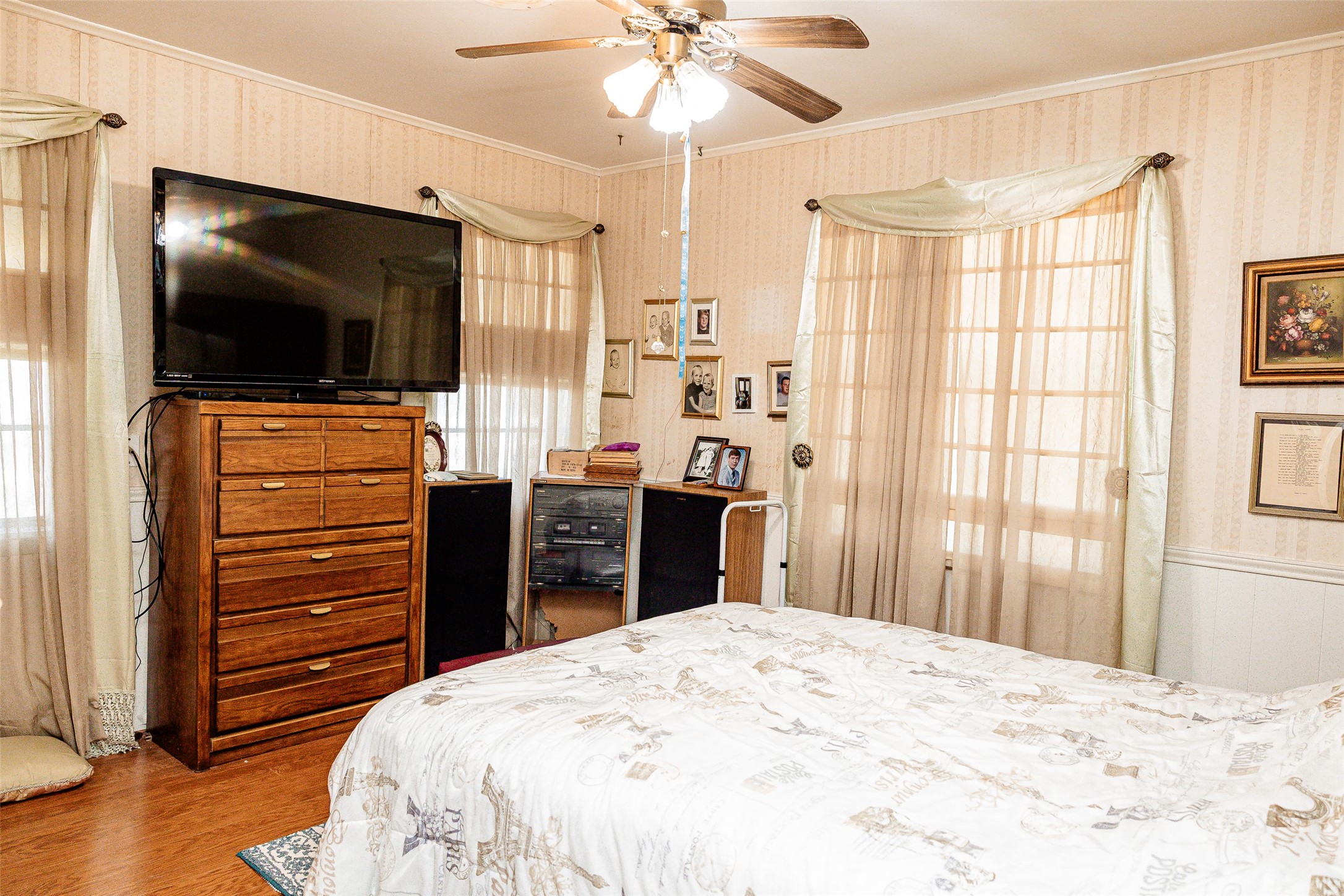 8608 Captain Scott Road Brenham, TX 77833 - Photo 14 of 28 a bedroom with a bed and a flat screen tv