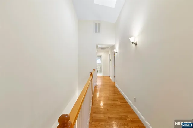 a view of a hallway with the white walls