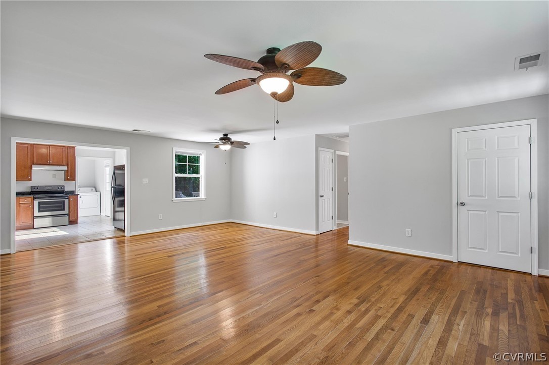 14020 Westfield Road Midlothian, VA 23113 - Photo 10 of 29 a view of an empty room with wooden floor and a window