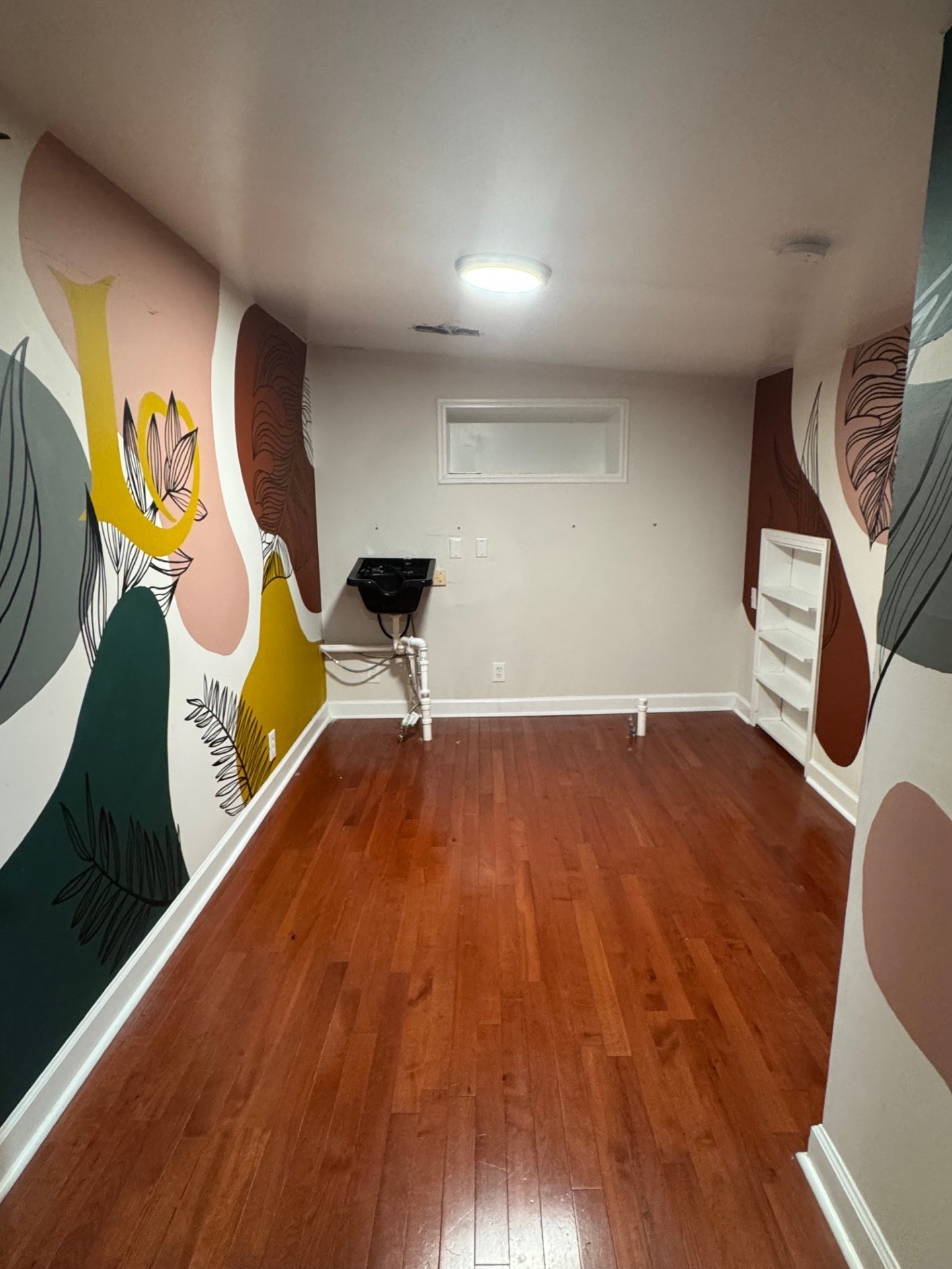 137 Franklin Street Clarksville, TN 37040 - Photo 14 of 16 a view of an empty room with wooden floor