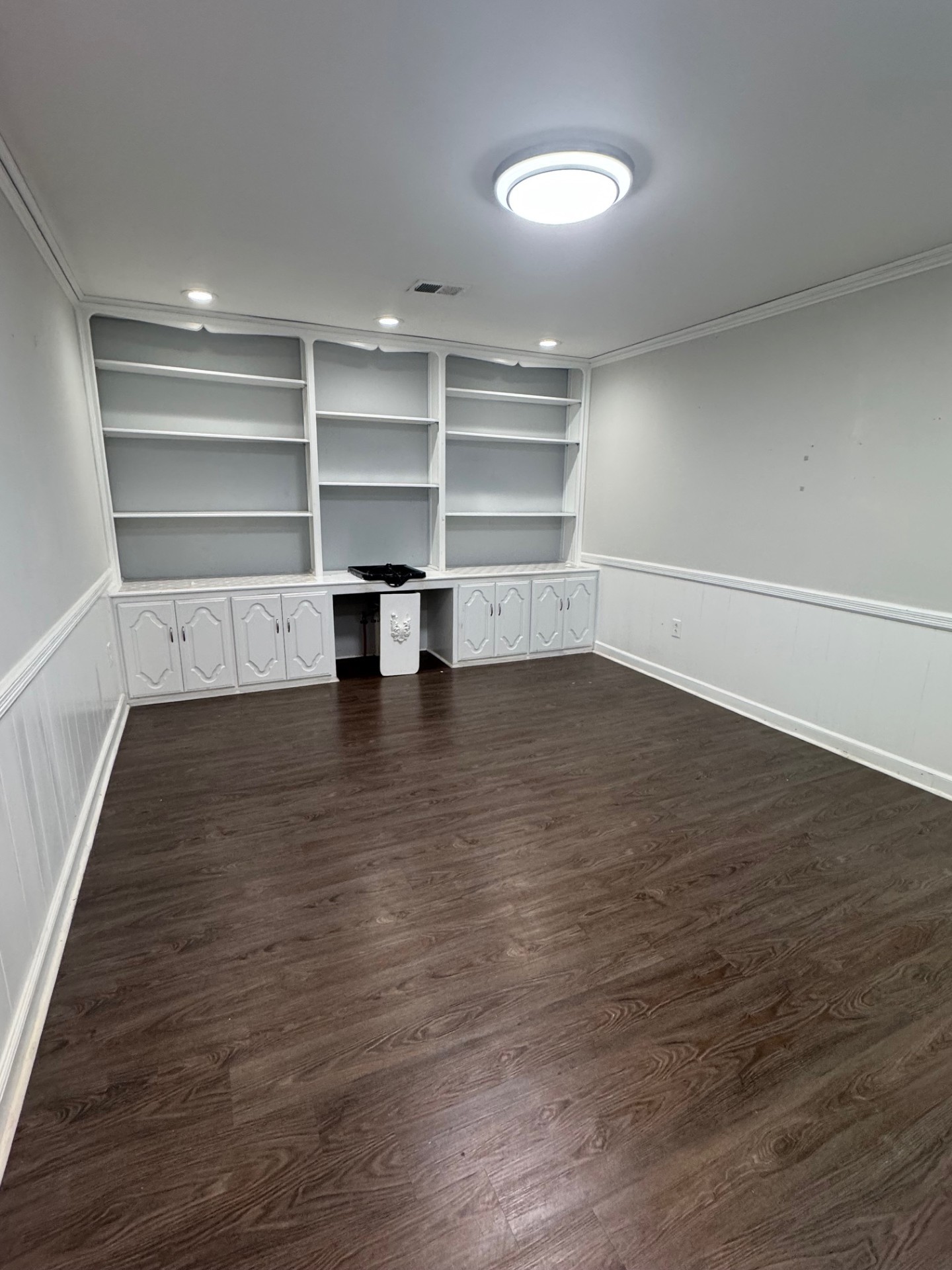 137 Franklin Street Clarksville, TN 37040 - Photo 7 of 16 a view of a room with an empty space and wooden floor