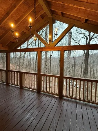 a view of porch with wooden floor