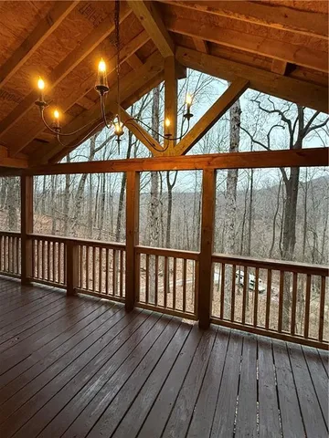 a view of porch with wooden floor
