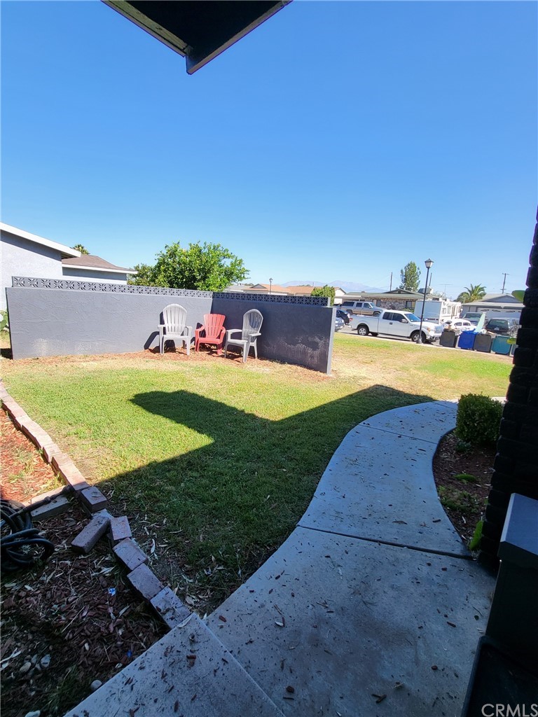 8346 Randolph Street Riverside, CA 92503 - Photo 1 of 1 a view of a swimming pool with a yard