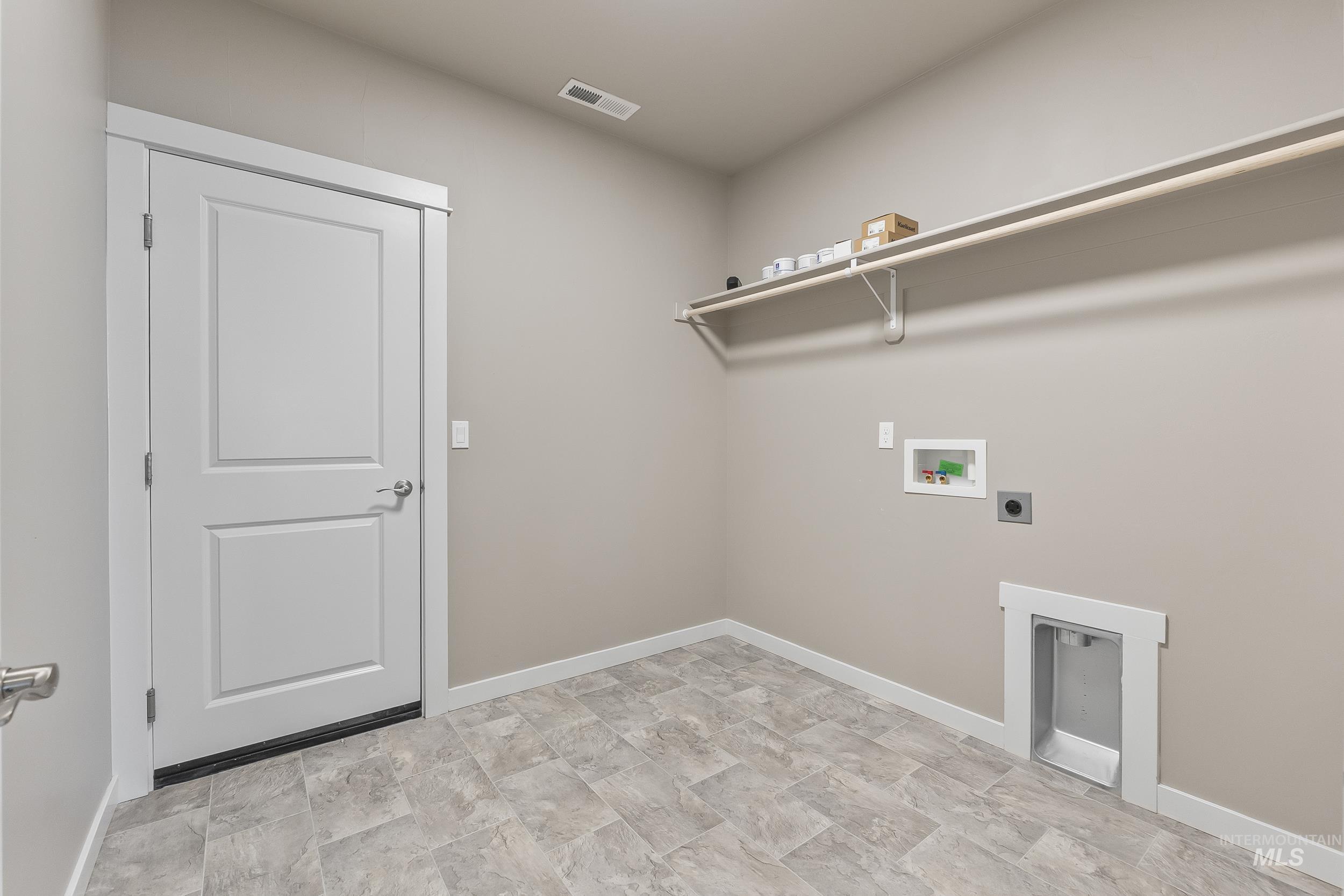 10308 West Trident Ridge Drive Star, ID 83669 - Photo 34 of 42 Laundry area featuring hookup for a washing machine, stone finish flooring, and hookup for an electric dryer