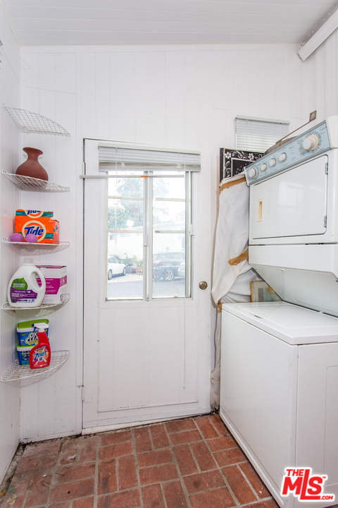 36 Copra Lane Pacific Palisades, CA 90272 - Photo 12 of 31 a utility room with dryer and washer