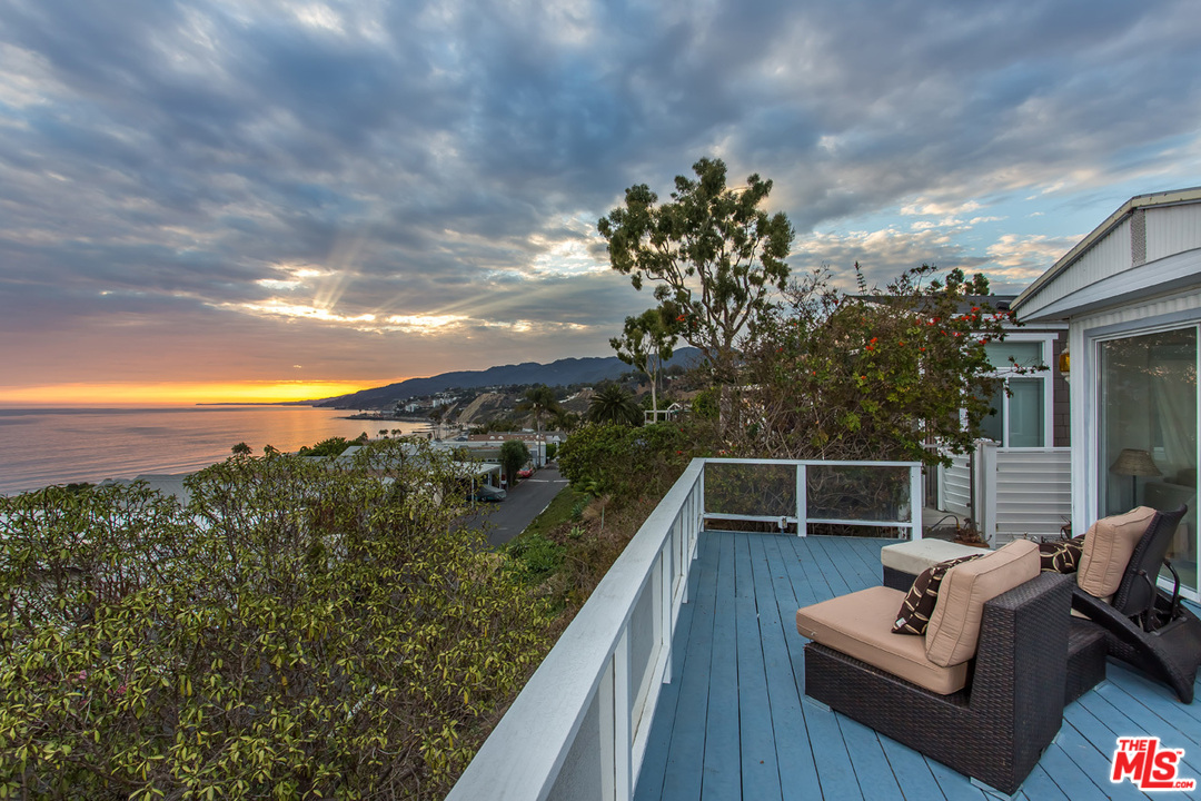 36 Copra Lane Pacific Palisades, CA 90272 - Photo 23 of 31 a view of a roof deck with couches and sky view