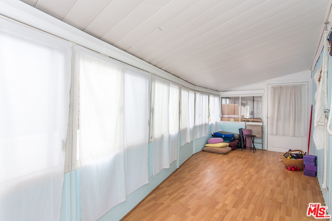 36 Copra Lane Pacific Palisades, CA 90272 - Photo 10 of 31 a view of a kids room with a large window