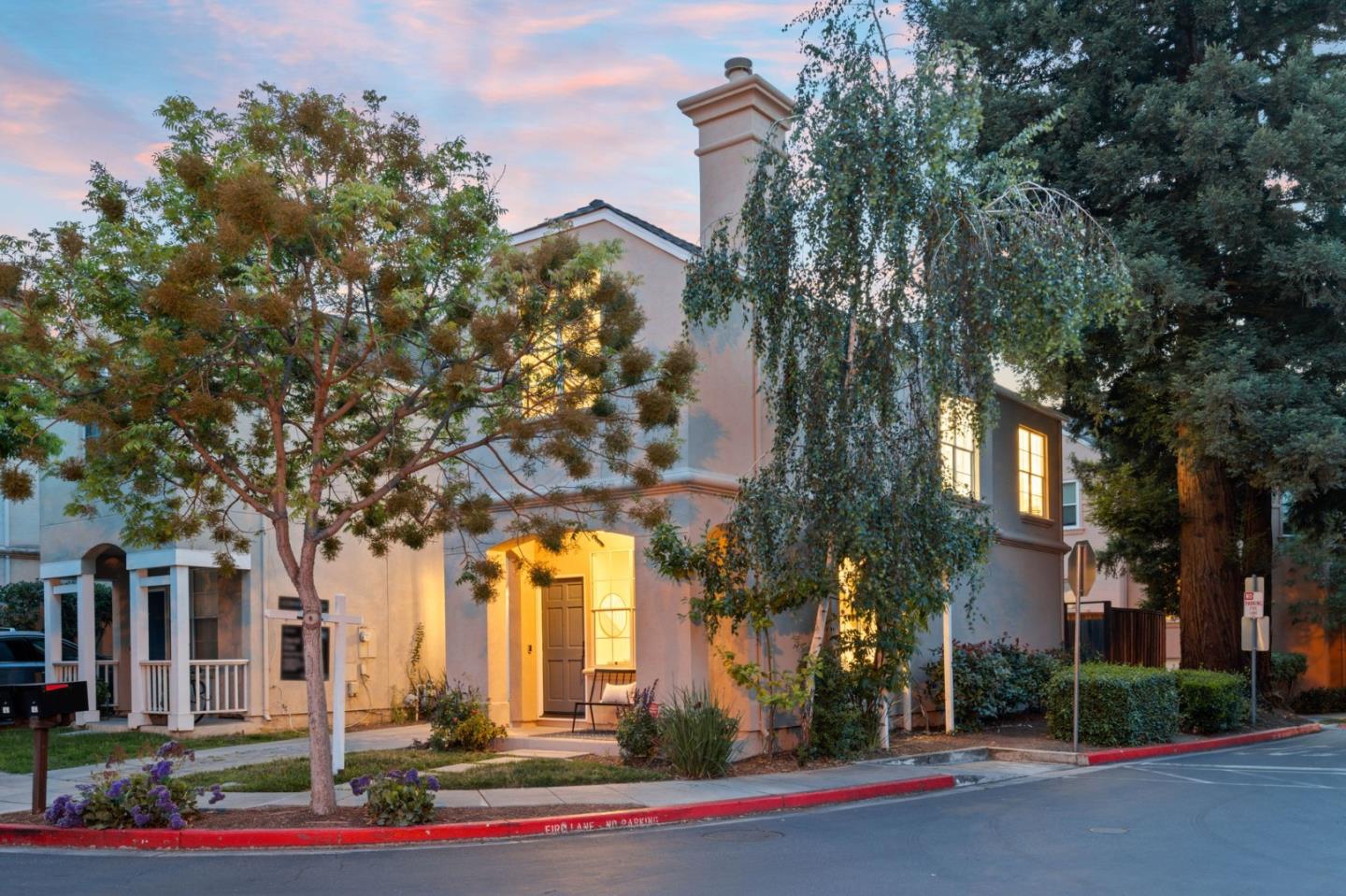 front view of a building with a tree